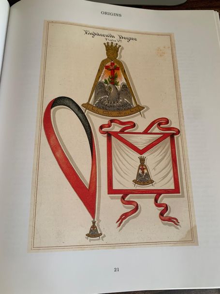 Full-page color illustration of Scottish Rite 18th Degree regalia, including a pelican jewel, red-bordered apron, and black-and-red collar.