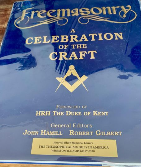 Front cover of the book titled "Freemasonry: A Celebration of the Craft" with gold lettering and a square and compass symbol on a dark blue 